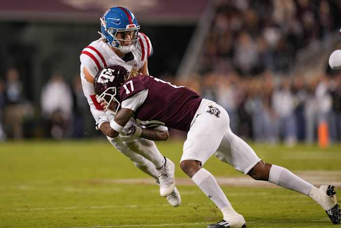 Oct 29, 2022; College Station, Texas, USA; Texas A&M Aggies defensive back Jaylon Jones (17) tackles Mississippi Rebels quarterback Jaxson Dart (2) in the first half at Kyle Field. Mandatory Credit: Daniel Dunn-USA TODAY Sports